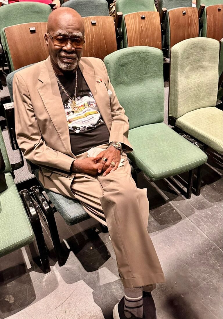 Elder Shadrock Porter seated at the July 2025 GAPAS anniversary performance