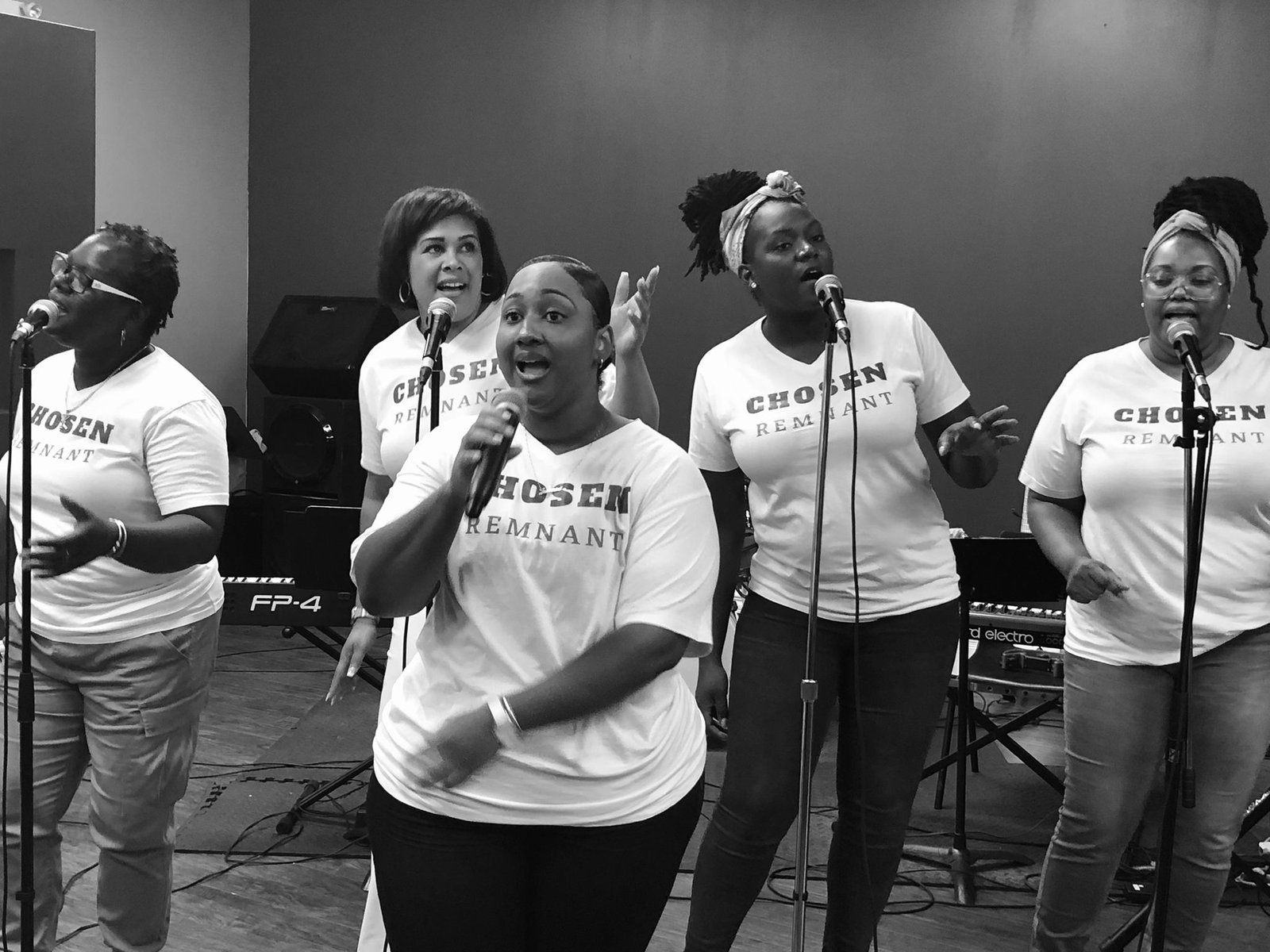 Chosen Remnant singers performing together in black and white